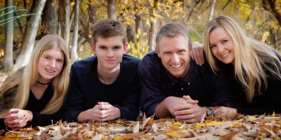 A fall time photo of a family in Kathryn Albertson Park