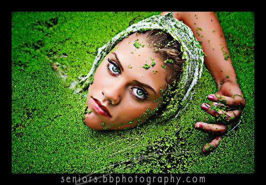 A professional photo of a lady covered in moss and Grass