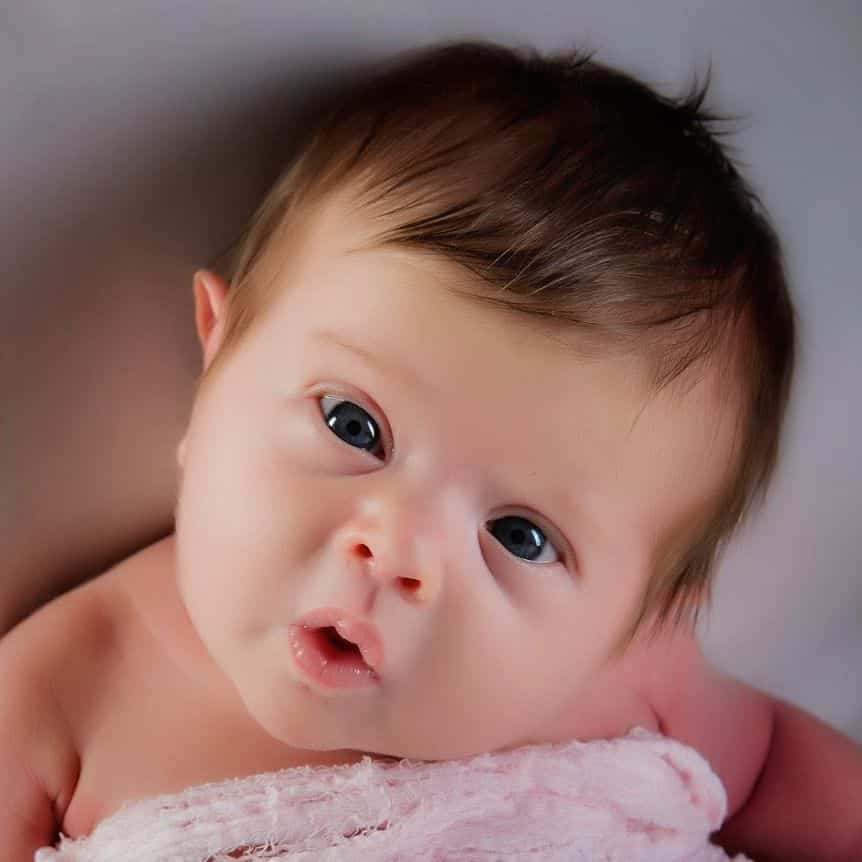 newborn smiling in photo