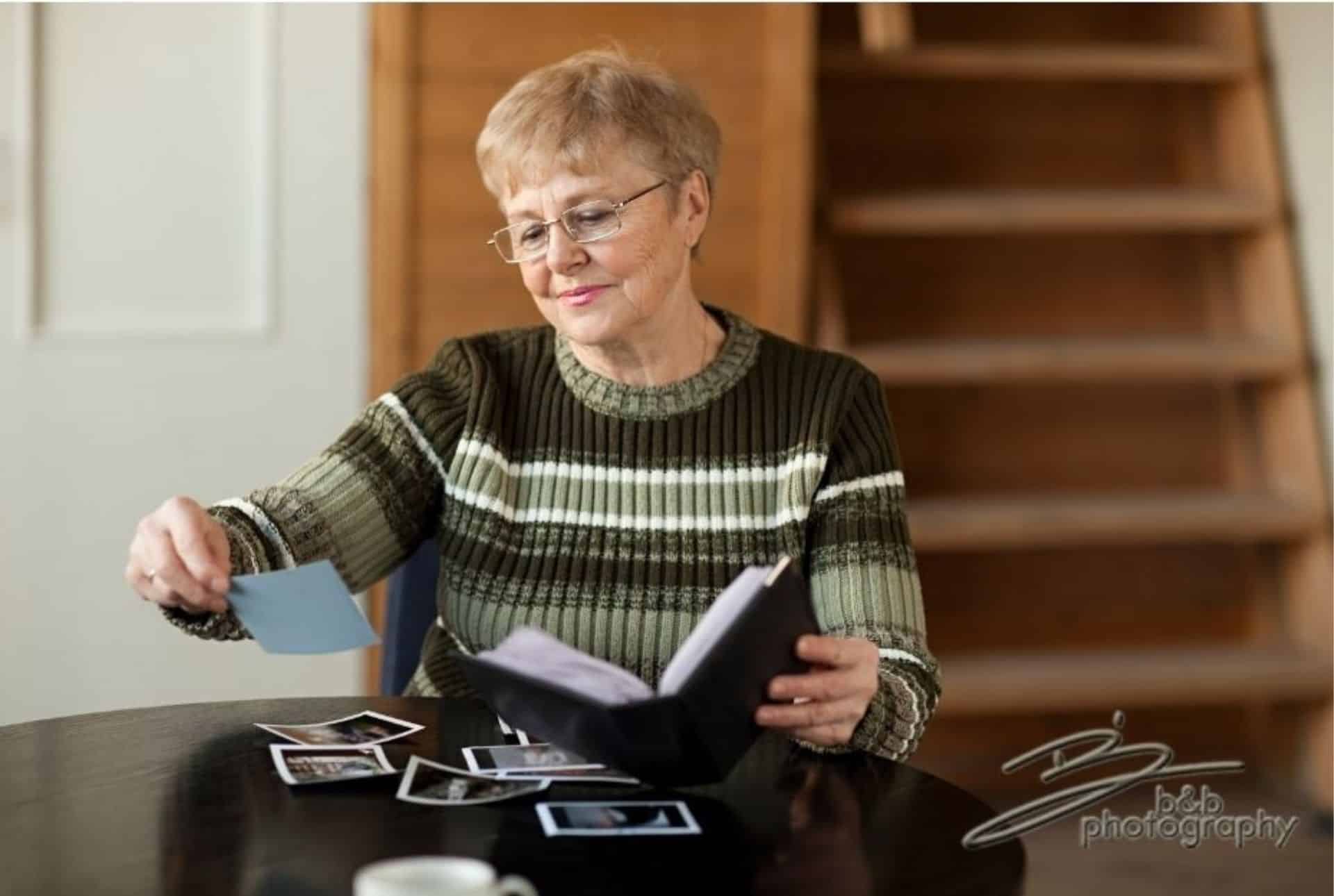 Woman looking through old photos