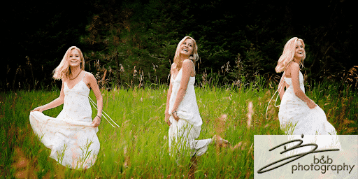 Young girl in a sundress dancing in a field.